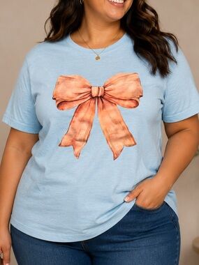 Hand Crafted Light Blue Short Sleeve Tee with Peach Bow Graphic LARGE